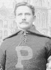 Wylie Glidden Woodruff on his football uniform and sporting a mustache in his 1893 Penn football photo.