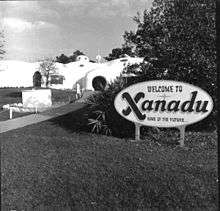 A photo of a welcome sign and entry path for the Xanadu house in Kissimmee, Florida.