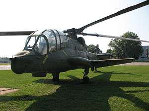 Quarter front view of the AH-56's front fuselage and canopy, showing the canopy to advantage. The aircraft is parked on a grassy surface for museum display.