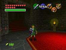 A young boy holds a sword in a dungeon lit by a candle