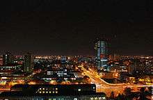 Zagreb at night, with a wide street and several tall buildings
