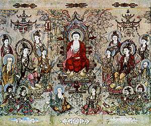A landscape oriented painting showing a Buddha in red robes, seated in a throne, surrounded by sixteen adult figures and one baby. With the exception of the baby, all of the figures, including the Buddha, have blue halos.